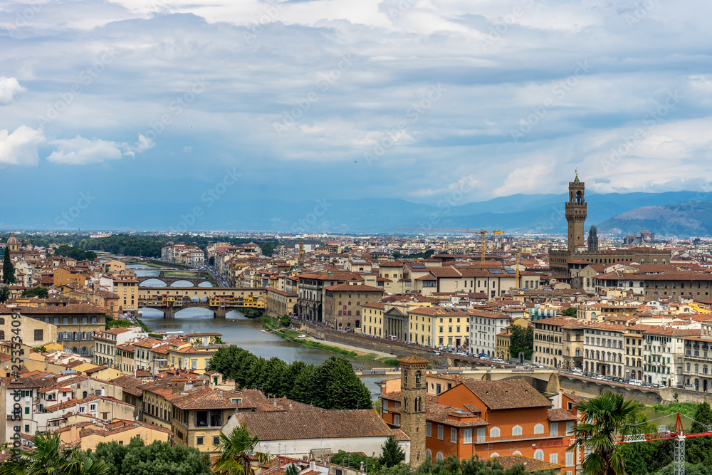 Panaromic view of Florence townscape cityscape viewed from Piazzale Michelangelo (Michelangelo Square) with ponte Vecchio and Palazzo Vecchio