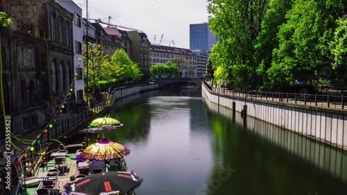 Time lapse from the water canal near the historic harbor on a sunny summer day. photo