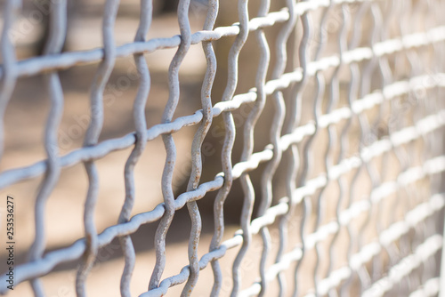 Metal chain-link fence on a background close-up