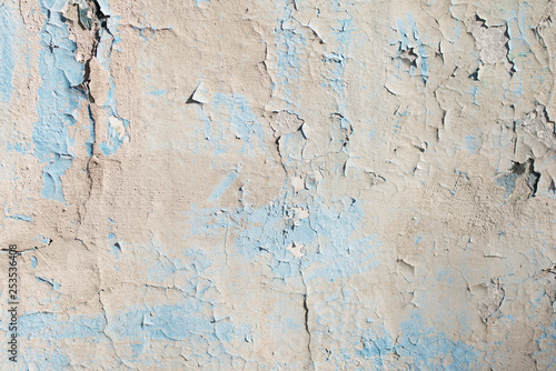 blue and grey texture with scratches and cracks. blue background. blue and grey pattern.light wall