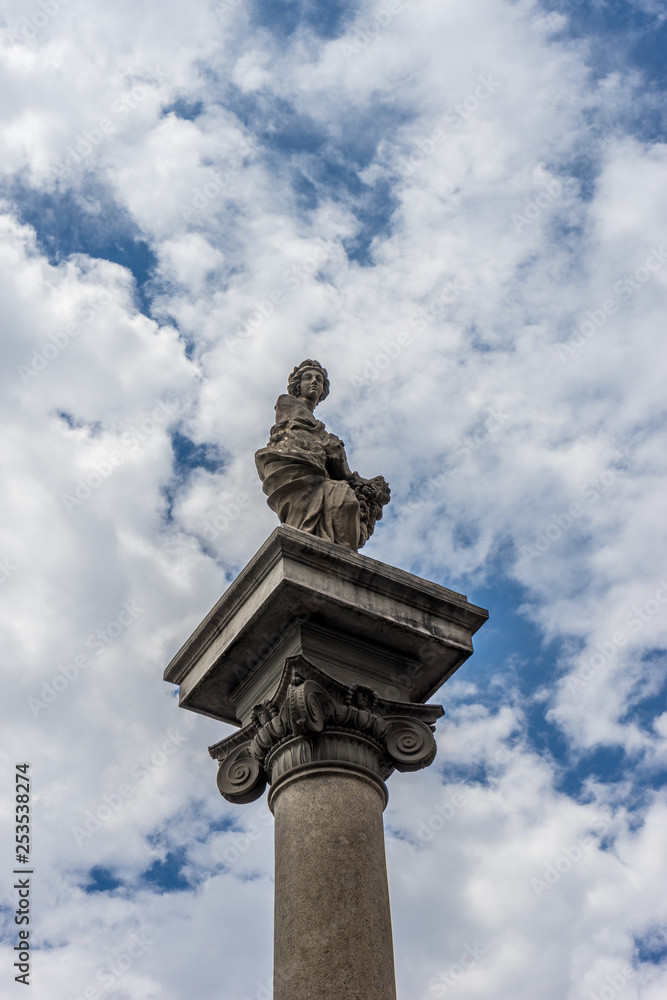 Italy,Florence, a tall clock tower sitting under a cloudy blue sky