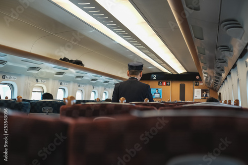 Photos Inside the passenger section of a shinkansen train in Japan.