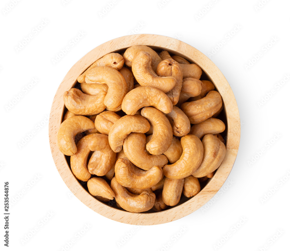 Roasted cashew nuts with salted in wood bowl isolated on white background Roasted cashew nuts with salted in wood bowl isolated on white background
