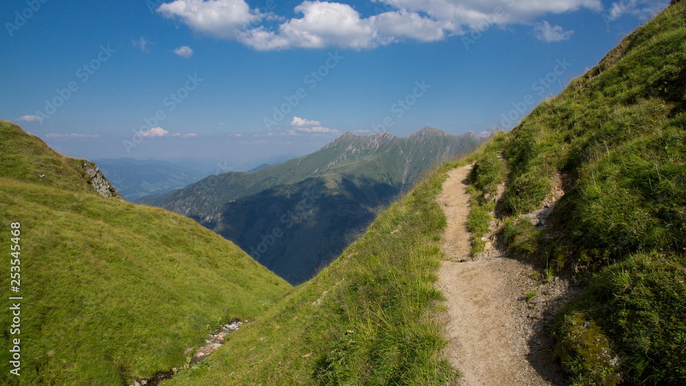 small path on mountain meadow blue sky with shadow small path on mountain meadow blue sky with shadow