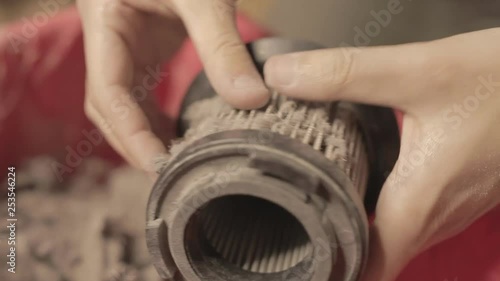 Cleaning vacuum cleaner filter close up