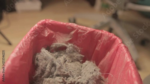 Touching and throwing dust into bin