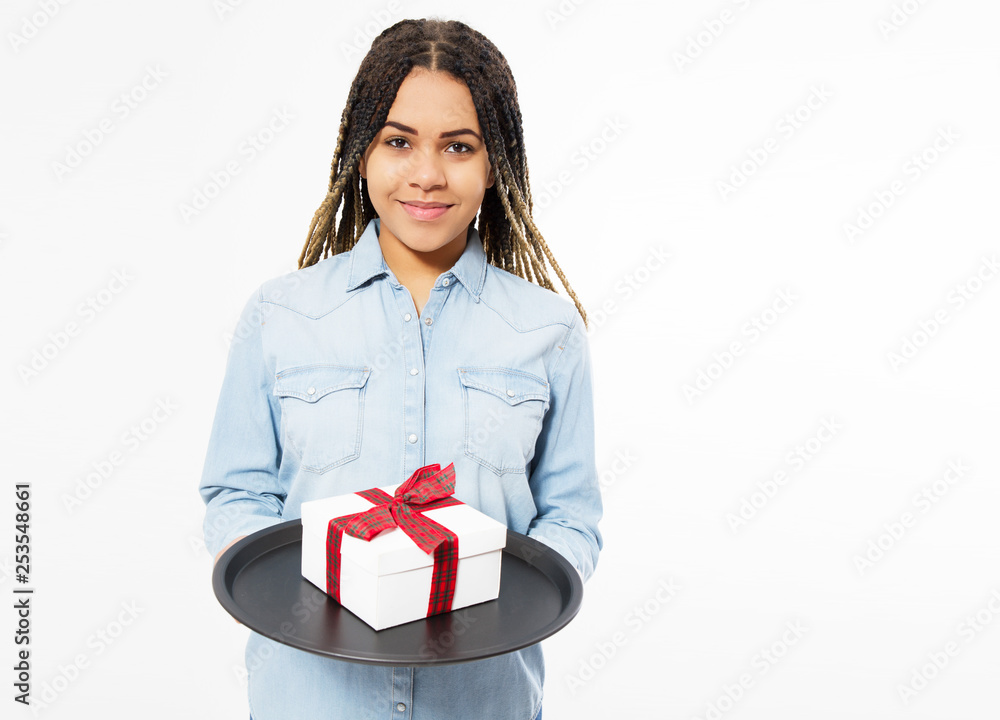 Happy woman 20s wrapped holding gift box on a tray isolated over white background . Happy woman 20s wrapped holding gift box on a tray isolated over white background .
