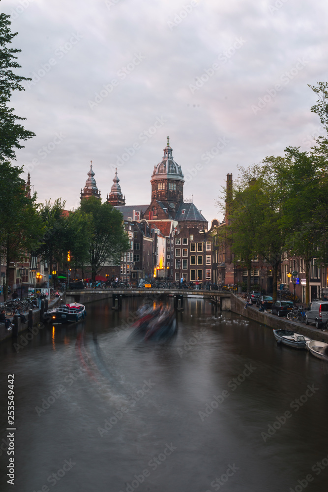 Church of Saint Nicholas dominating the main canal from Red Lights District at the center of Amsterdam, Holland, The Netherlands.