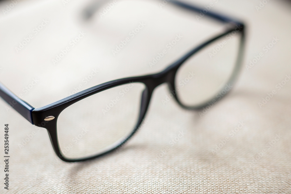 Reading spectacles, fashionable eyeglasses isolated on blurred white copy space background. Reading spectacles, fashionable eyeglasses isolated on blurred white copy space background.