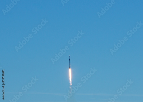 Rocket launch on a clear blue sky cloudless day. © Joni