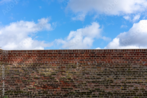 red wall and blue sky