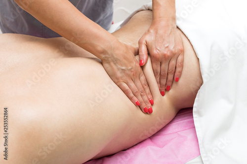 Young man on wellness treatments sports massage