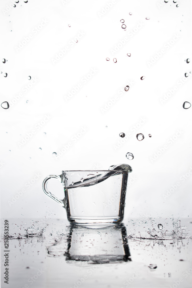A Cup Of Water Is On The Wet Table White Background With Falling Water Drops Reflection And Small Drops On A Horizontal Surface Vertical View Stock Photo Adobe Stock A Cup Of Water Is On The Wet Table White Background With Falling Water Drops Reflection And Small Drops On A Horizontal Surface Vertical View Stock Photo Adobe Stock