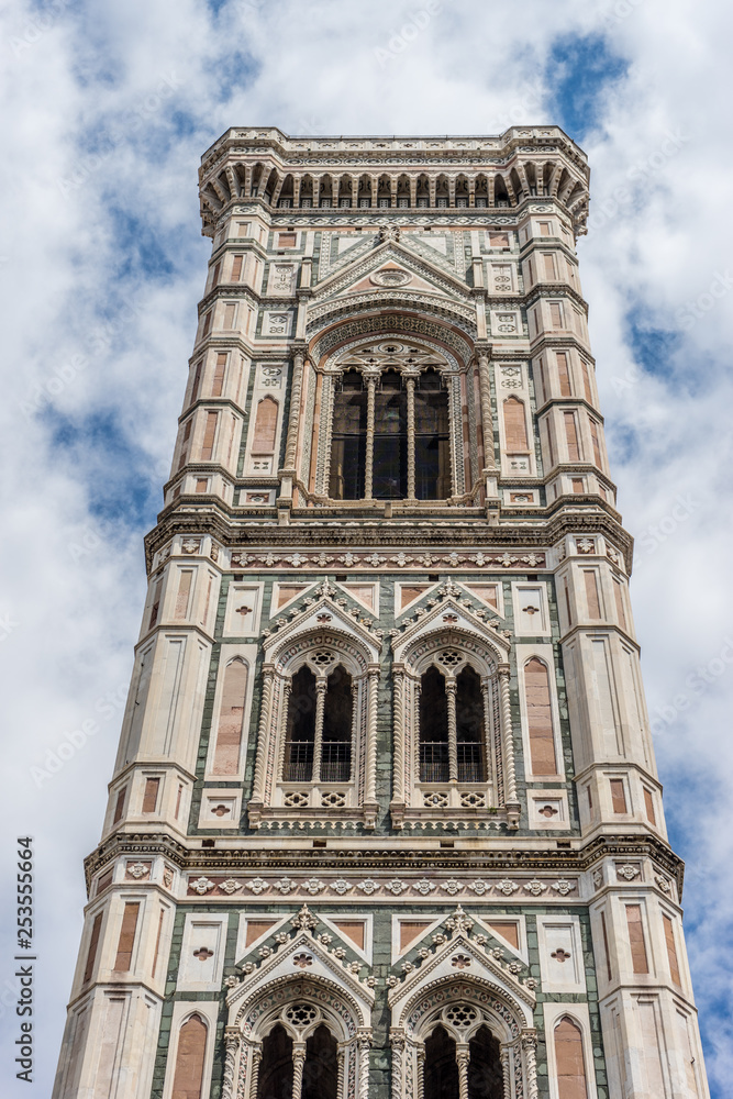 Italy,Florence, Giotto's Campanile, a large tall tower with a clock at the top of a stone building with Giotto's Campanile in the background