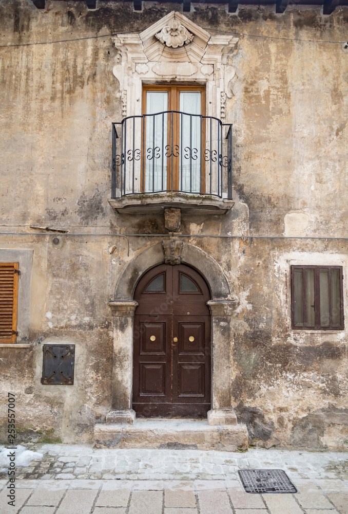 Old wooden italian door in the small village of Scanno Old wooden italian door in the small village of Scanno