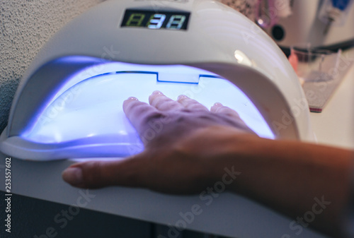 The machine for drying of nails. Accessories for manicure. Drying of acrylic in the machine.