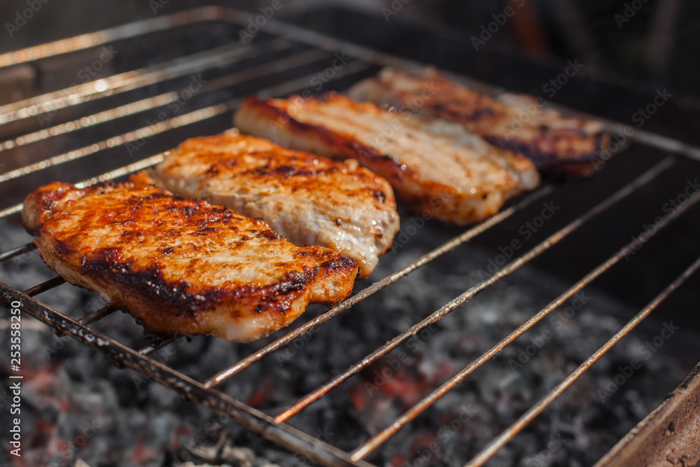 cooking meat on the grill. Steaks on the grill cooking meat on the grill. Steaks on the grill