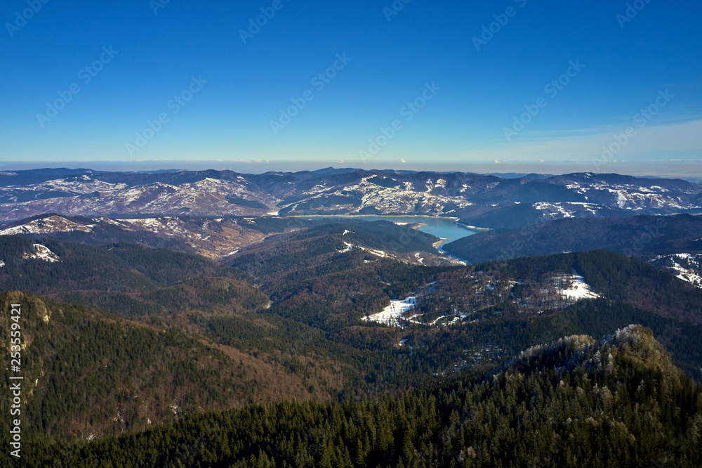 Aerial Landscape view from Ceahlău Mountains National Park at sunrise in winter season