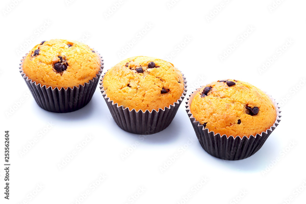Cupcake, muffin with raisins and chocolate isolated on white background. Delicious homemade Muffins. Top view. Cupcake, muffin with raisins and chocolate isolated on white background. Delicious homemade Muffins. Top view.
