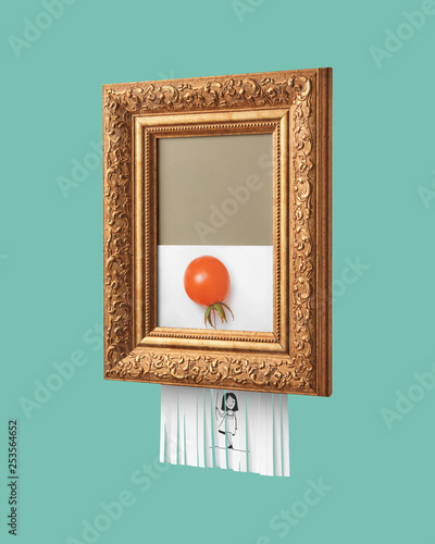 Vintage frame with a Self-destructive picture of a smiling girl holding a balloon, made of tomato, on a blue background. The symbol of modern art. photo