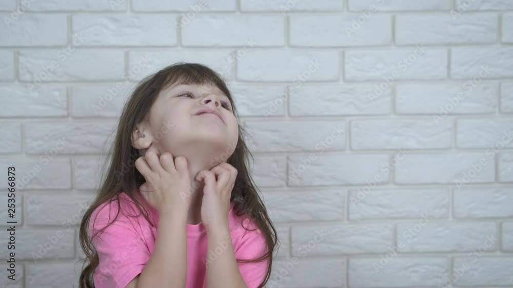 Allergy. The child has itching. A little girl scratches her neck. Allergy. The child has itching. A little girl scratches her neck.