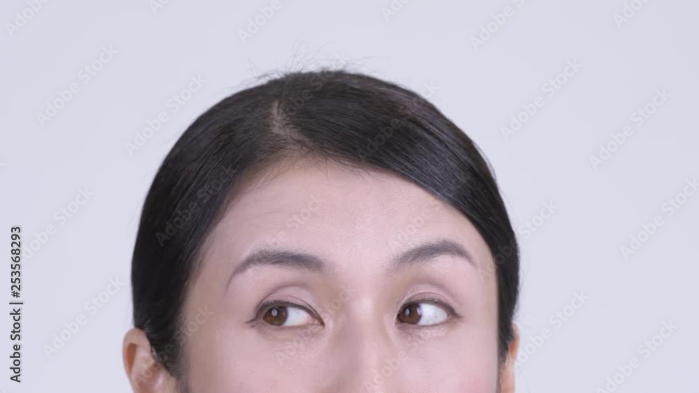 Eyes of Asian businesswoman thinking and looking up