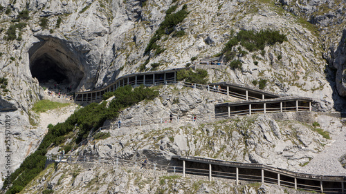 hiking path to ice cave entrance on mountain photo