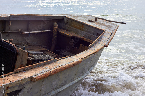 Part of fishing boat on the sandy sea beach