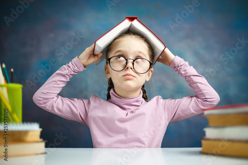 Cute Schoolgirl Shout Cover Head with Open Book photo