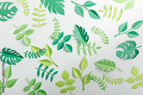 top view of paper plants on grey background