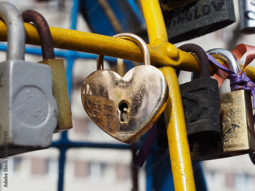 The metal padlock heart shaped