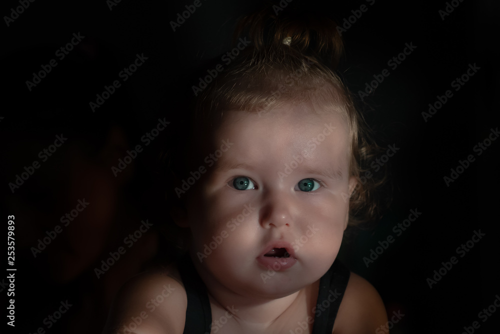 surprised and satisfied baby face on black background surprised and satisfied baby face on black background