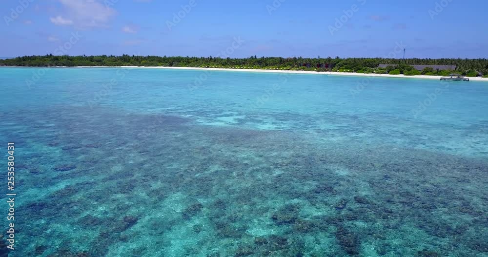Low aerial drone towards secluded Philippines beach and stunning scenery. Crystal clear water and colourful environment along the horizon. Low aerial drone towards secluded Philippines beach and stunning scenery. Crystal clear water and colourful environment along the horizon.