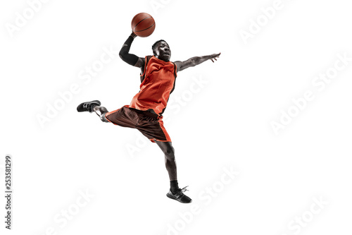 Full length portrait of a basketball player with a ball isolated on white studio background. advertising concept. Fit african anerican athlete jumping with ball. Motion, activity, movement concepts.