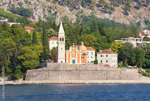 Beautiful summer Mediterranean landscape. Montenegro, Adriatic Sea, Bay of Kotor. View of Church of St. Matthew in Dobrota town ( near Kotor city ) from the sea