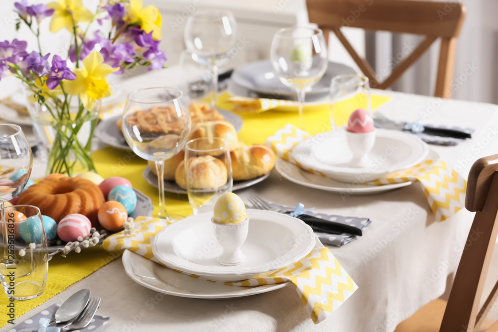 Fototapeta premium Festive Easter table setting with traditional meal at home