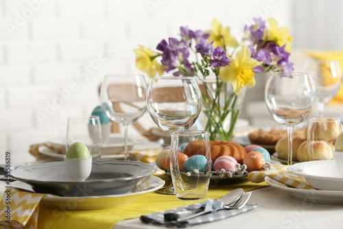 Festive Easter table setting with traditional meal at home