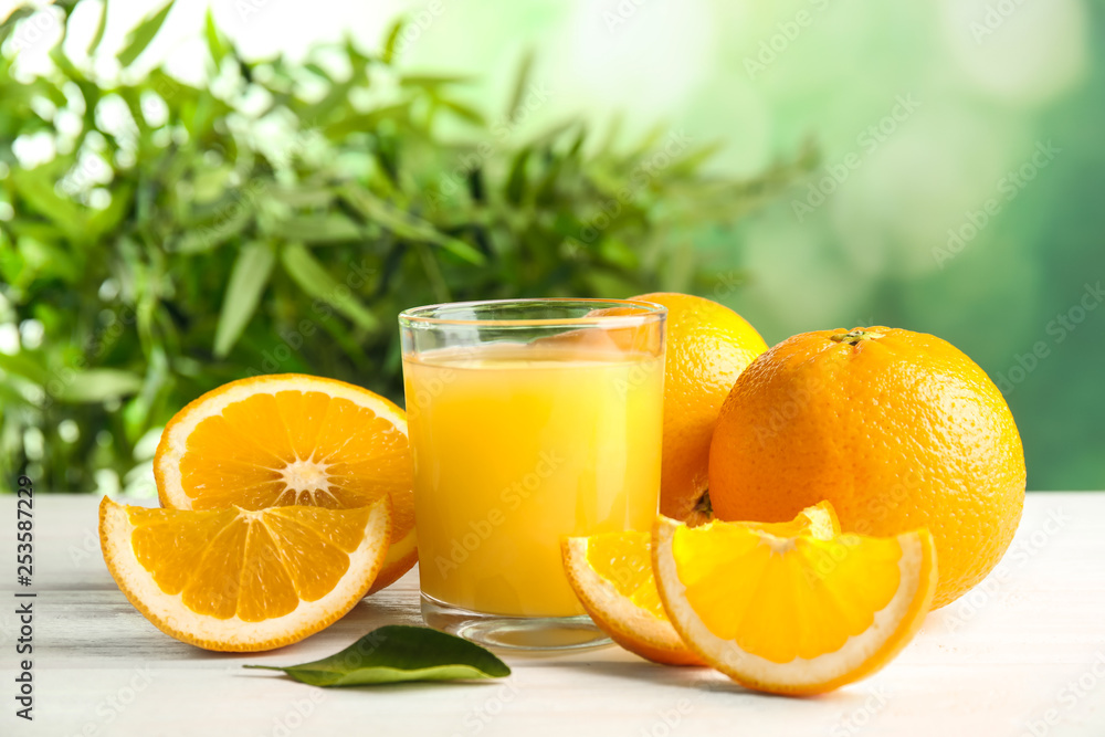 Composition with orange juice and fresh fruit on table Composition with orange juice and fresh fruit on table
