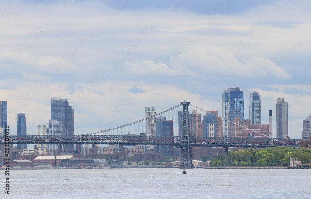 Manhattan bridge and skyline of New York City with skyscrapers background. View from Roosevelt Island Manhattan bridge and skyline of New York City with skyscrapers background. View from Roosevelt Island