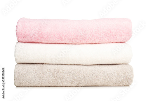 Folded soft terry towels on white background