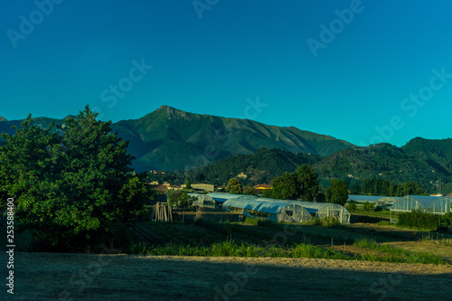 Wallpaper Mural Italian outskirts train Pisa Riomaggiore, a field with a mountain in the background Torontodigital.ca