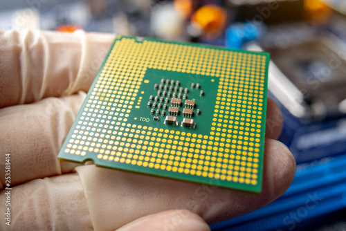 Slika na platnu Chip microprocessor in the hands of an engineer technician for the computers