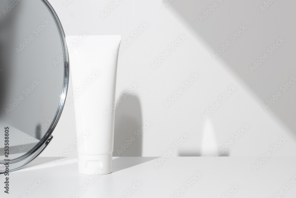 mockup of body lotion cream facial beauty spa cosmetic tube pakage container with mirror and long shadow background mockup of body lotion cream facial beauty spa cosmetic tube pakage container with mirror and long shadow background