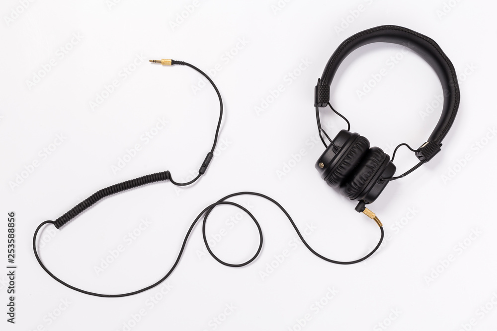 Black headphones on white background Black headphones on white background