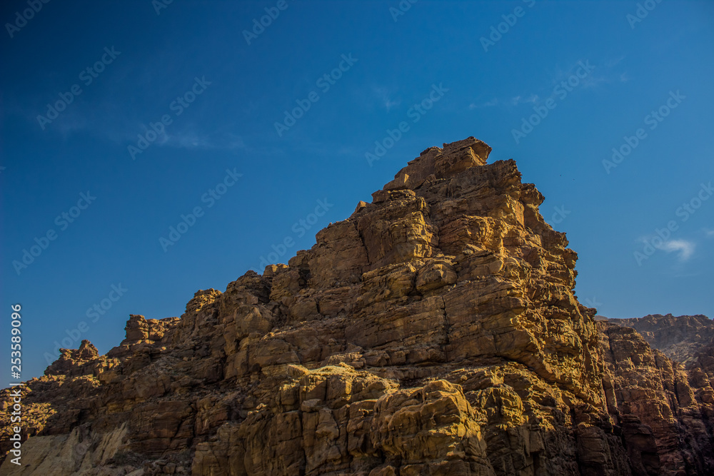 lonely rocky steep mountain object in Middle East country desert environment