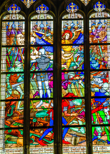 Joan of Arc war scene on colorful stained glass window inside the Cathedral of the Holy Cross in Orleans  France
