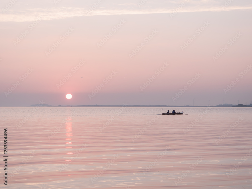 Rowboat and sunset on the sea Rowboat and sunset on the sea