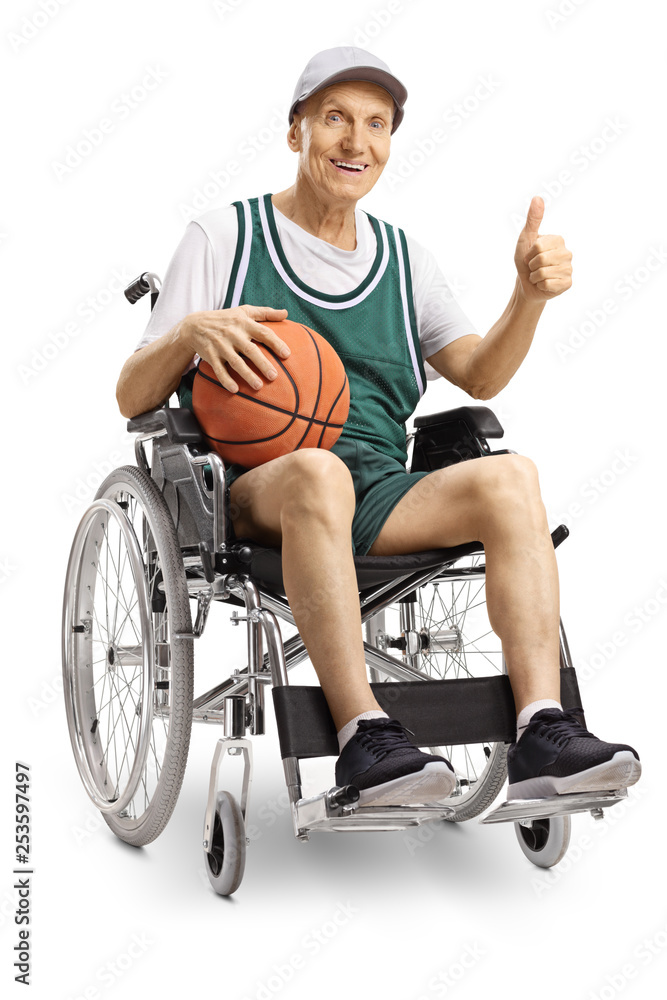 Disabled elderly man in a wheelchair holding a basketball and showing thumbs up Disabled elderly man in a wheelchair holding a basketball and showing thumbs up