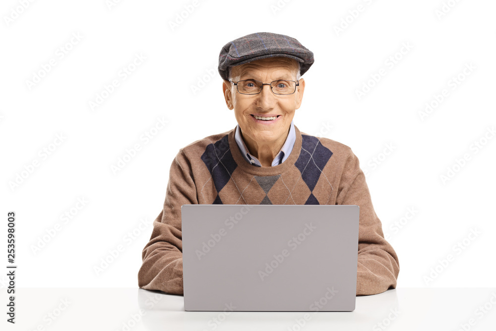 Senior man sitting with a laptop and looking at the camera Senior man sitting with a laptop and looking at the camera