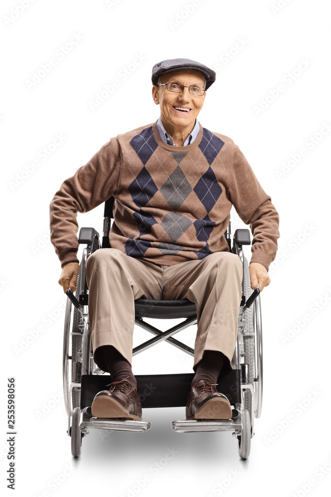 Elderly disabled man in a wheelchair manually pushing the wheels Elderly disabled man in a wheelchair manually pushing the wheels